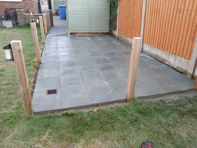 Grey patio with timber posts
