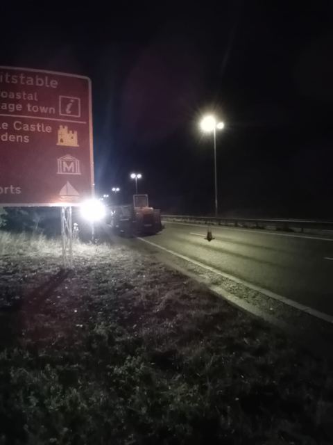 Road sign installation at night